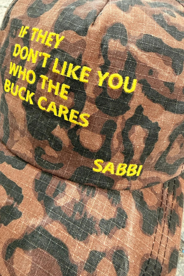 SABBI THE WHO THE BUCK CARES CAP