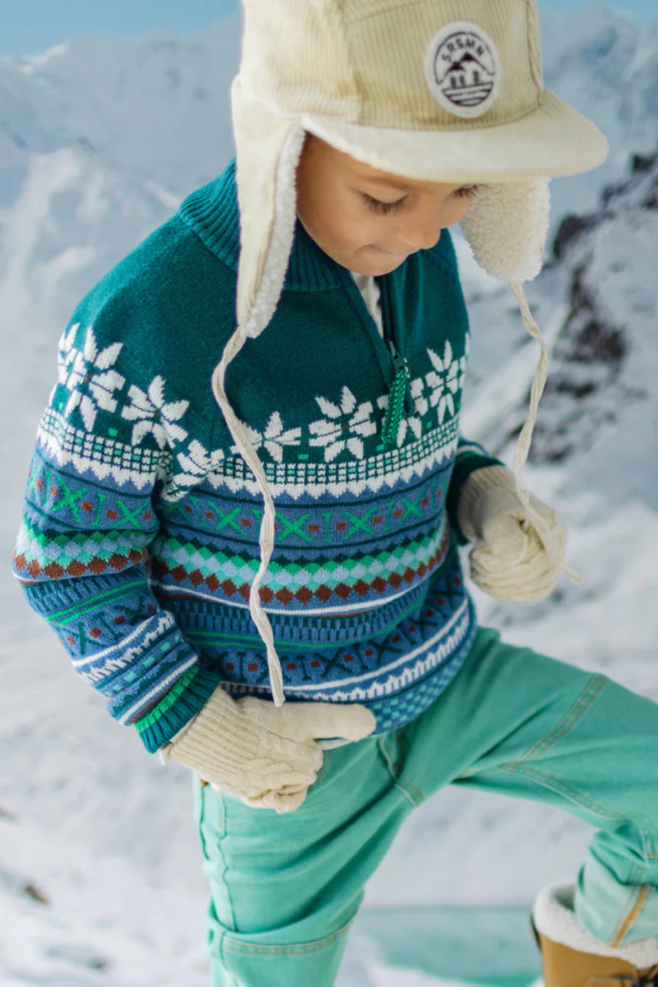 Teal knit sweater with patterns