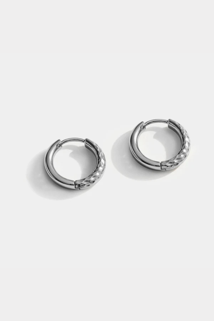 Silver half textured stainless steel huggie earrings