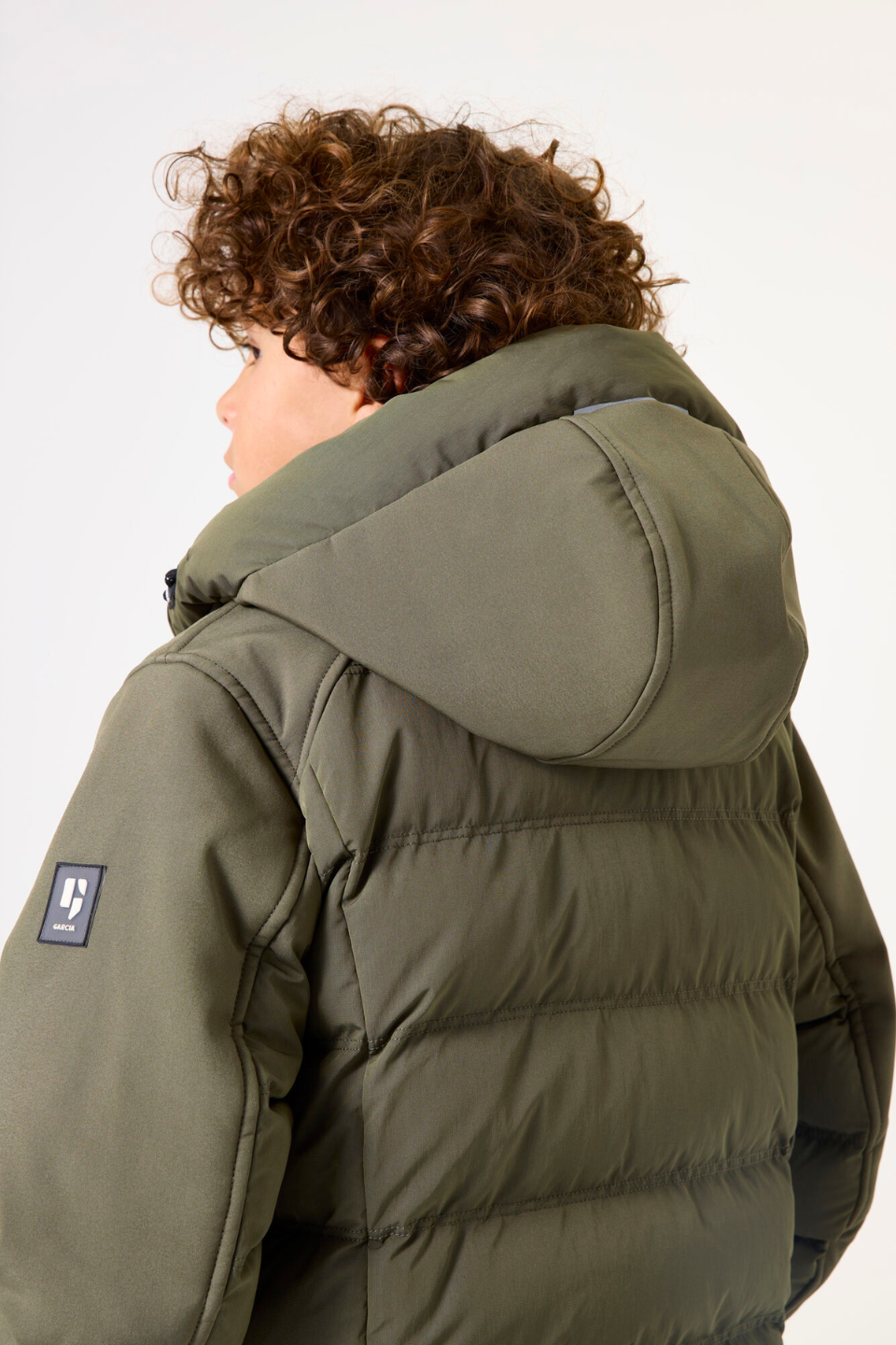 Green softshell puffer jacket