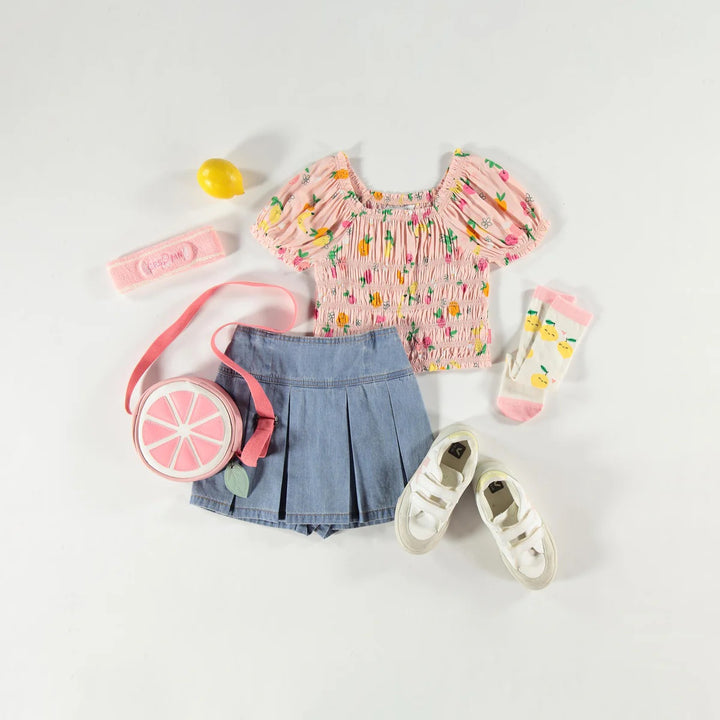 Light blue pleated skort in lightweight denim