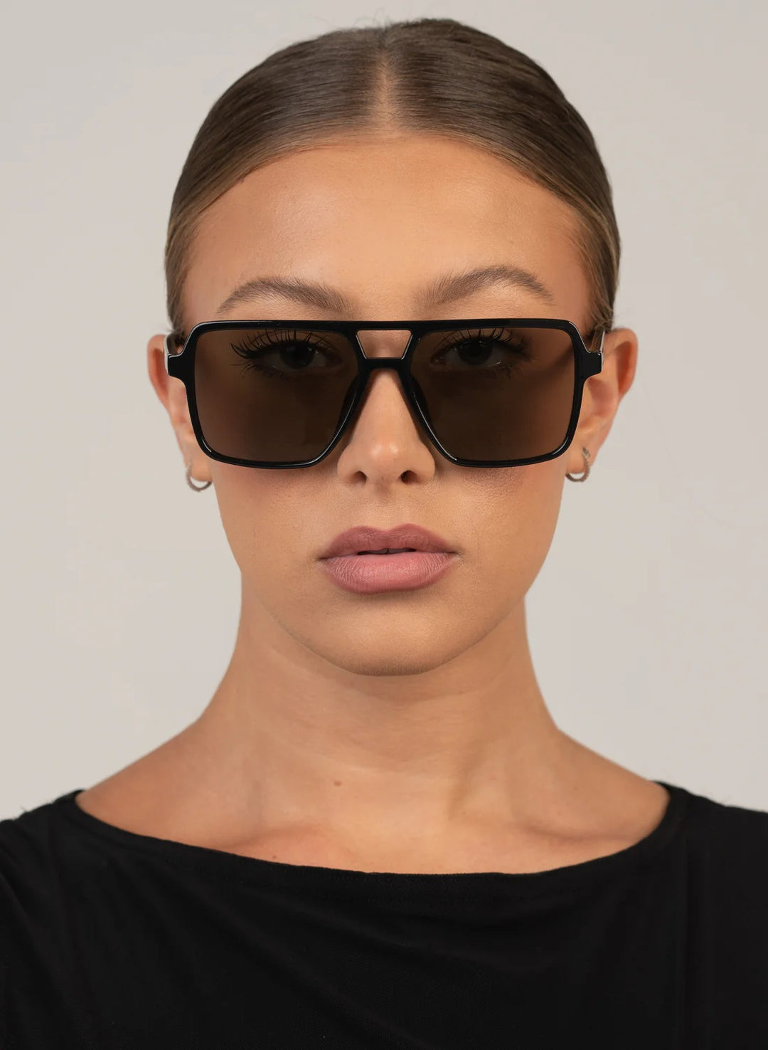 Oversized shiny black square aviator with a smoke lens